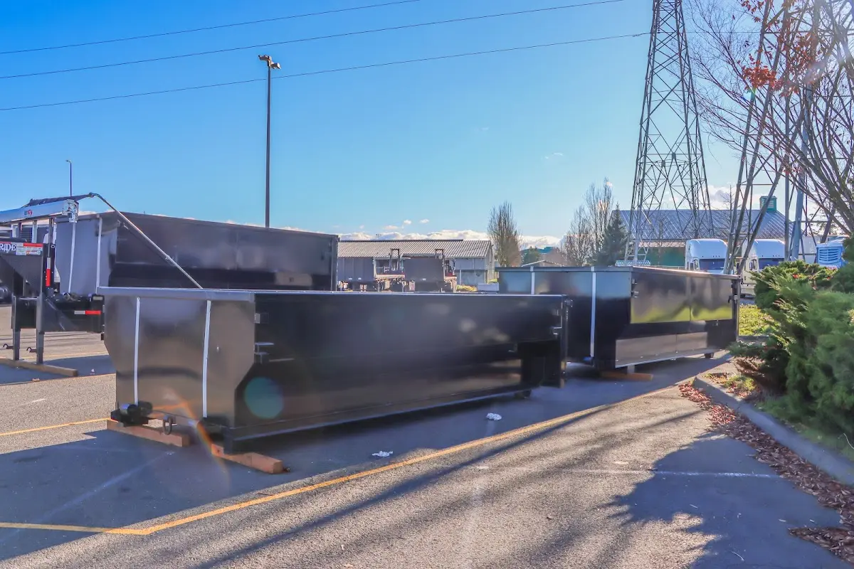 Roll-off dumpster ready for waste disposal at job site for Yard Waste Dumpster Rental in Oxford